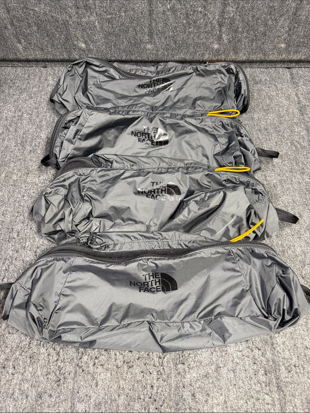 The North Face set of 4 Gray luggage Pack with Yellow Pull Tabs - Picture 3 of 8